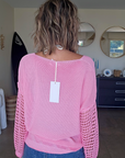 Pull ajouré rose