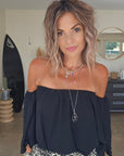 Blouse noire épaules dénudées
