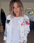 Veste rock blanche à tags