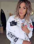 Veste rock blanche à tags