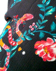 Jupe asymétrique noire à imprimé fleuri