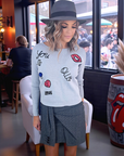 Pull gris écussons