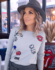 Pull gris écussons