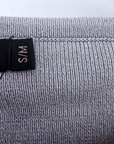 Pull gris écussons
