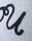 Pull gris écussons