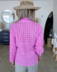 Veste rose ajourée