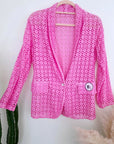 Veste rose ajourée