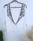 Cardigan blanc à encolure en V profonde