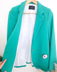 Veste cintrée verte avec pins éclair