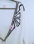 Cardigan blanc à encolure en V profonde
