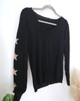 Pull noir à maille fine dos à strass