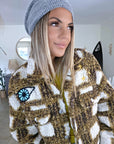 Manteau teddy bouclette à tags