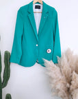 Veste cintrée verte avec pins éclair