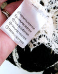 Pull ajouré noir et écru
