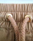 Short beige à bandes latérales