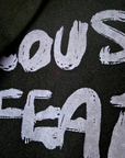 Veste noire à tags parmes