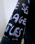 Veste noire à tags parmes