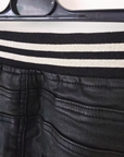 Pantalon slim noir huilé