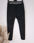 Pantalon slim noir huilé