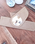 Ceinture élastique beige à boucle dorée