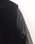 Manteau teddy noir manches cuir et peau retournée
