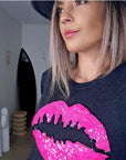 Pull bouche rose fluo