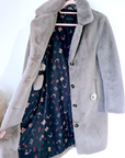 Manteau fausse fourrure