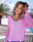 Pull ajouré rose