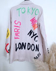 Veste beige à tags et inscriptions fluo