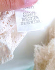 Haut beige asymétrique en crochet
