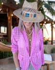 Veste rose ajourée