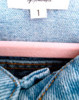 Veste en jean à inscriptions en perles
