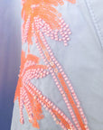 Chemise bleu ciel à palmiers orange fluo