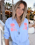 Chemise bleu ciel à palmiers orange fluo