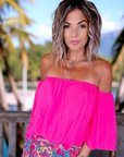 Blouse fuchsia épaules dénudées