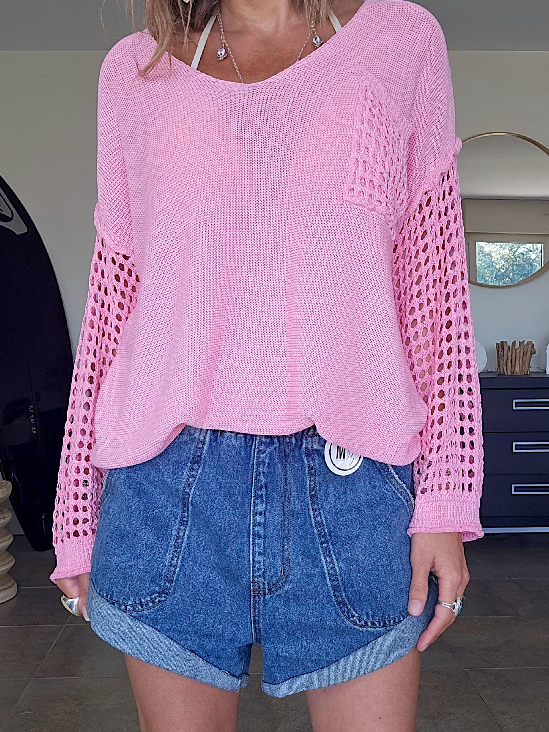 Pull ajouré rose