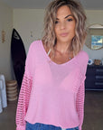 Pull ajouré rose