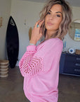 Pull ajouré rose