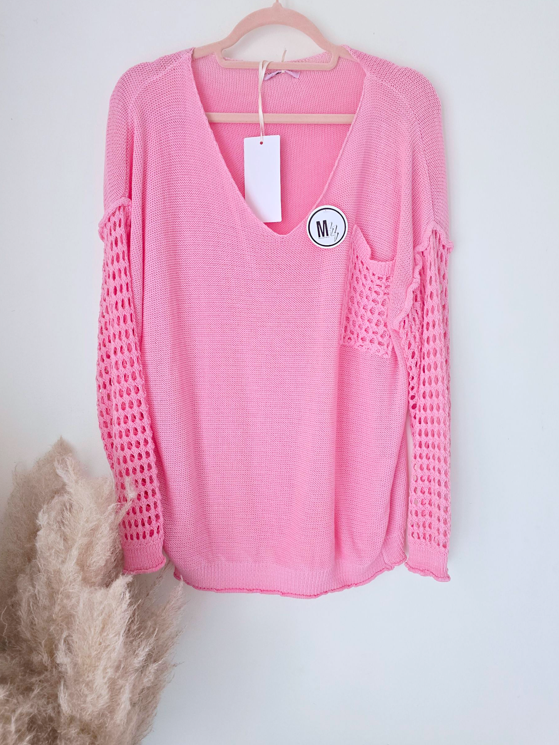 Pull ajouré rose