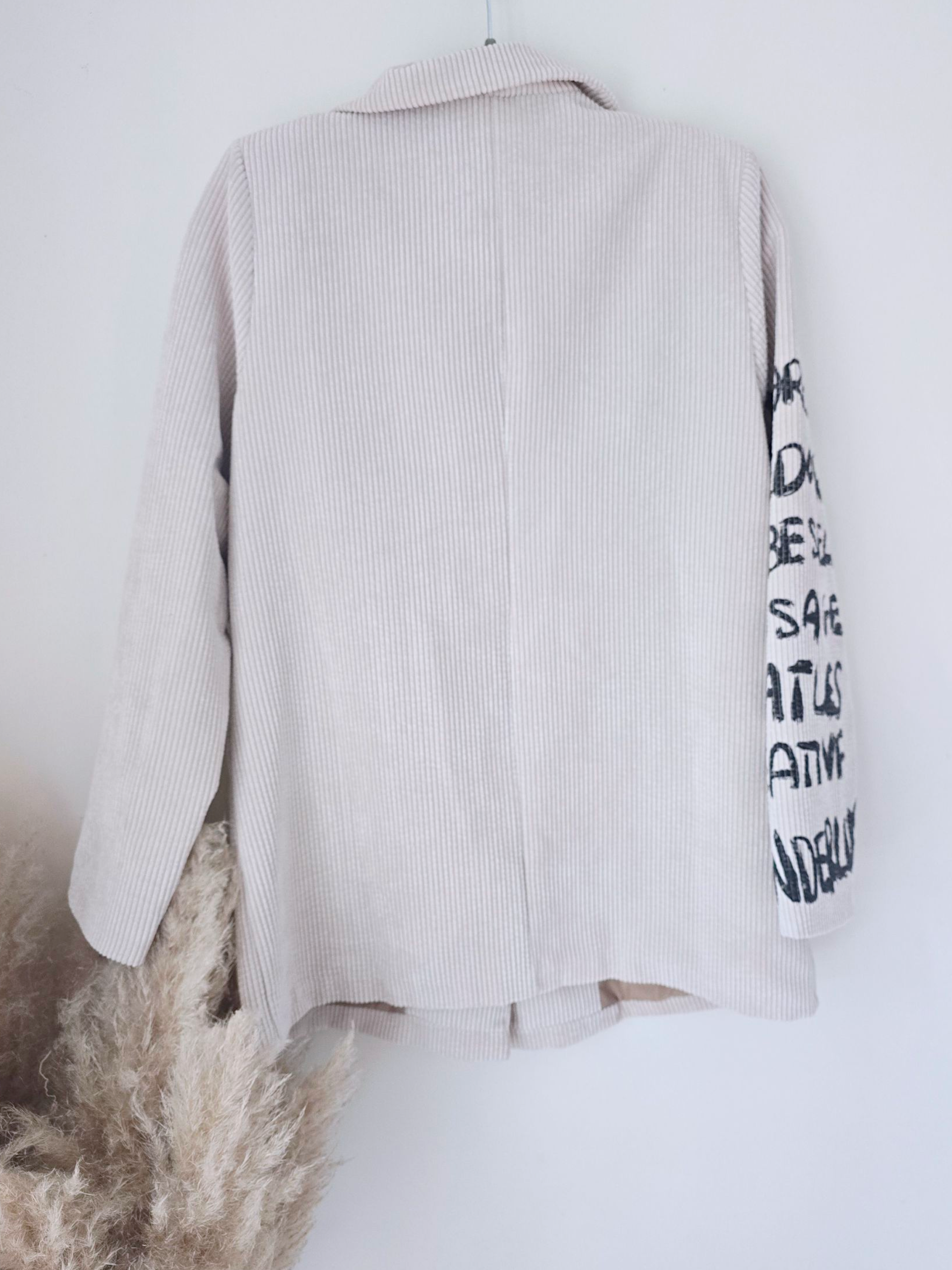 Veste velours écru à tags