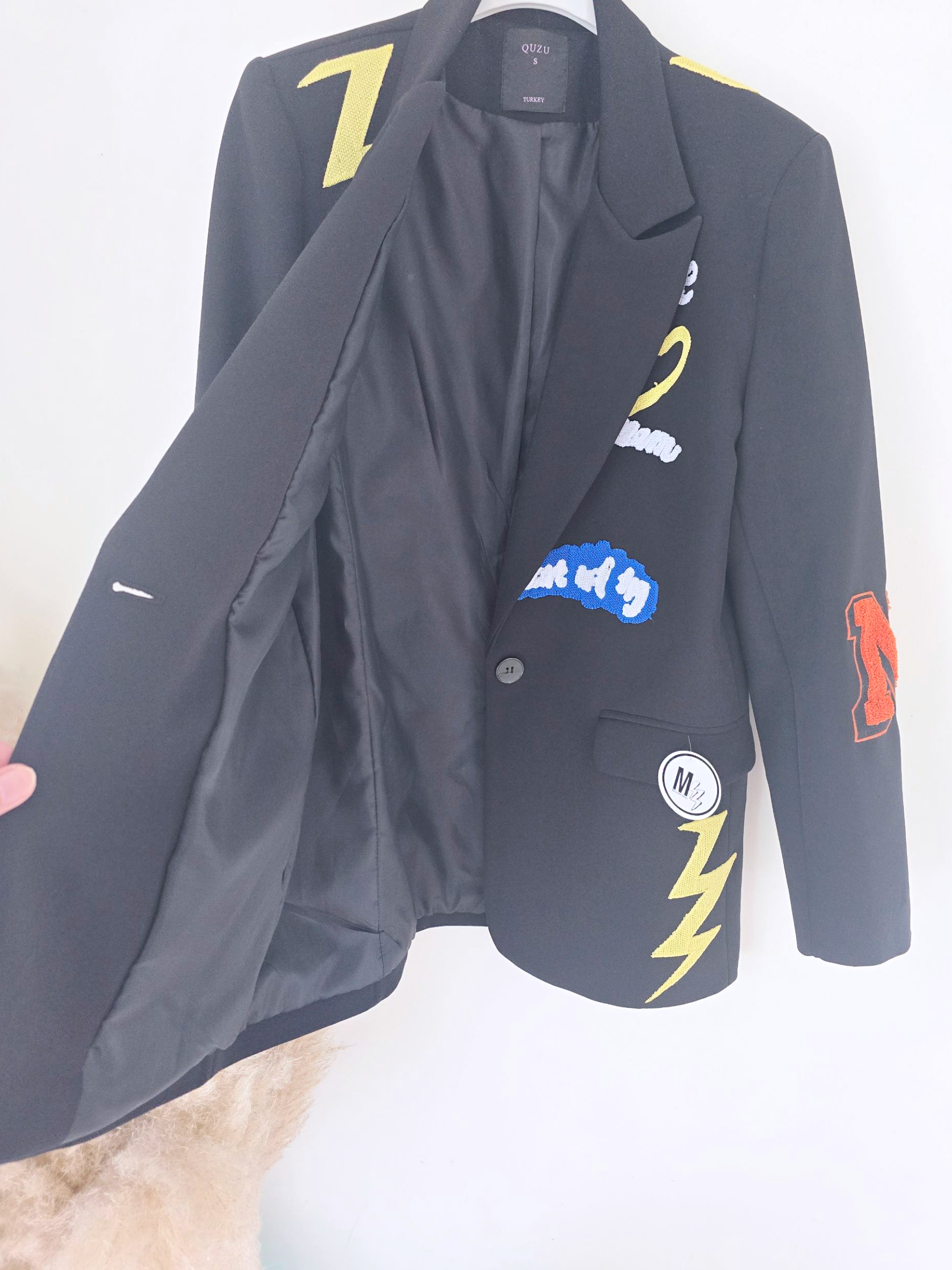 Veste noire à tags smiley