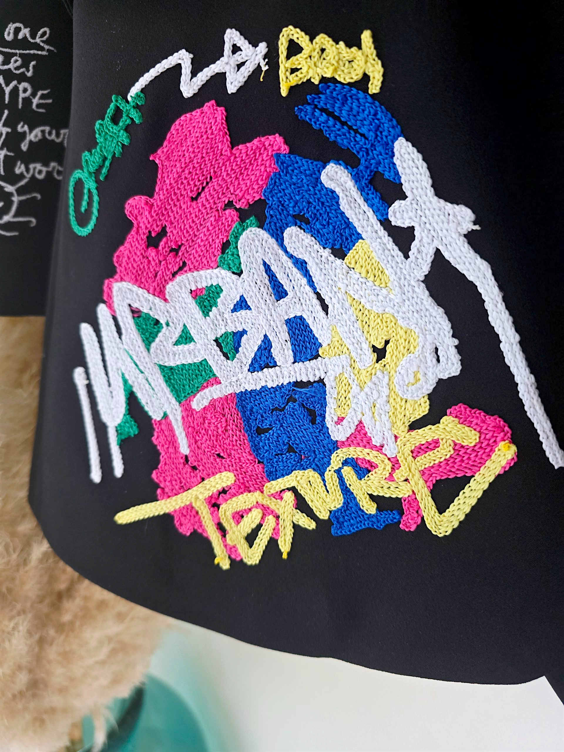 Veste noire à tags smiley