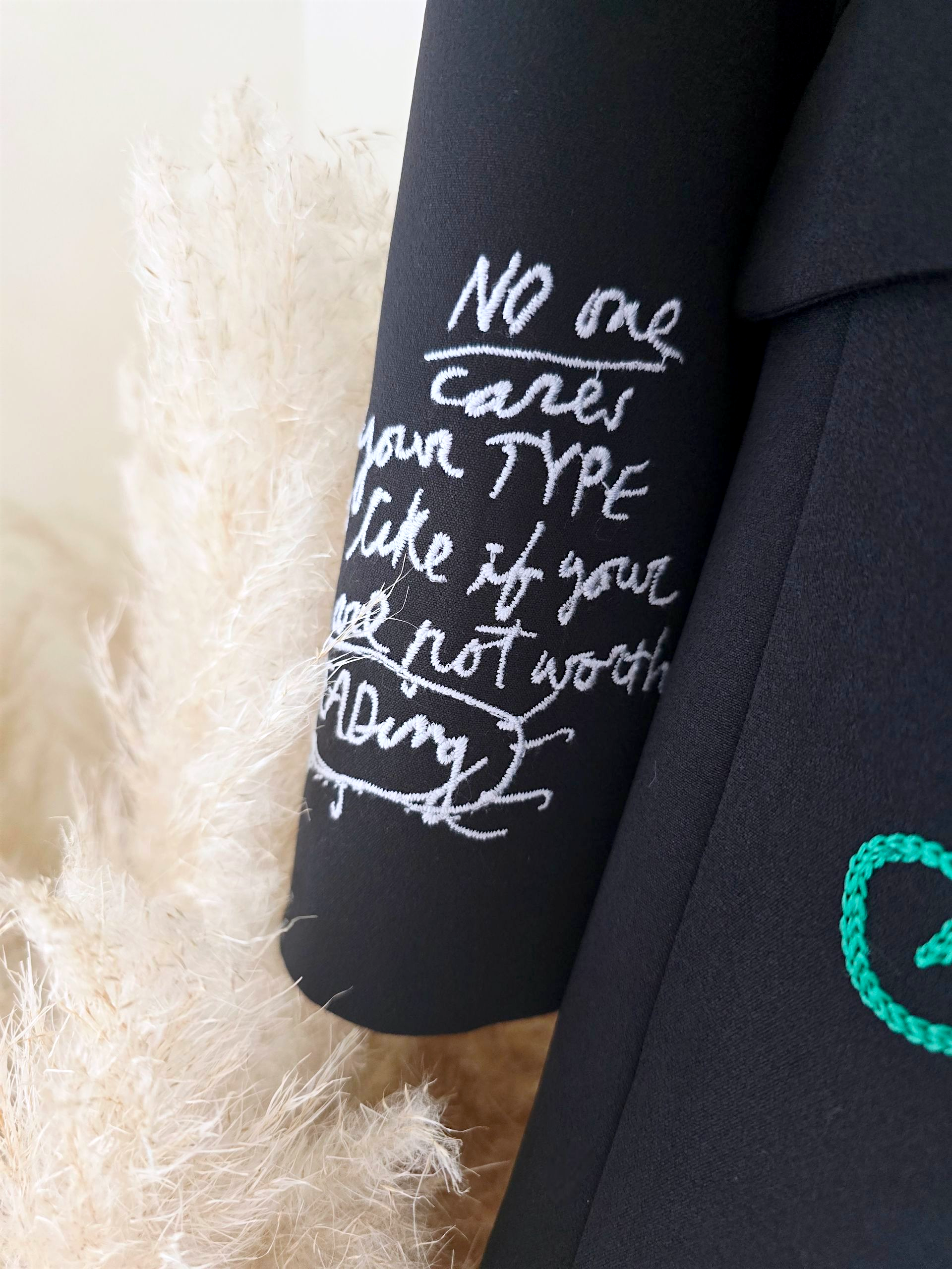 Veste noire à tags smiley