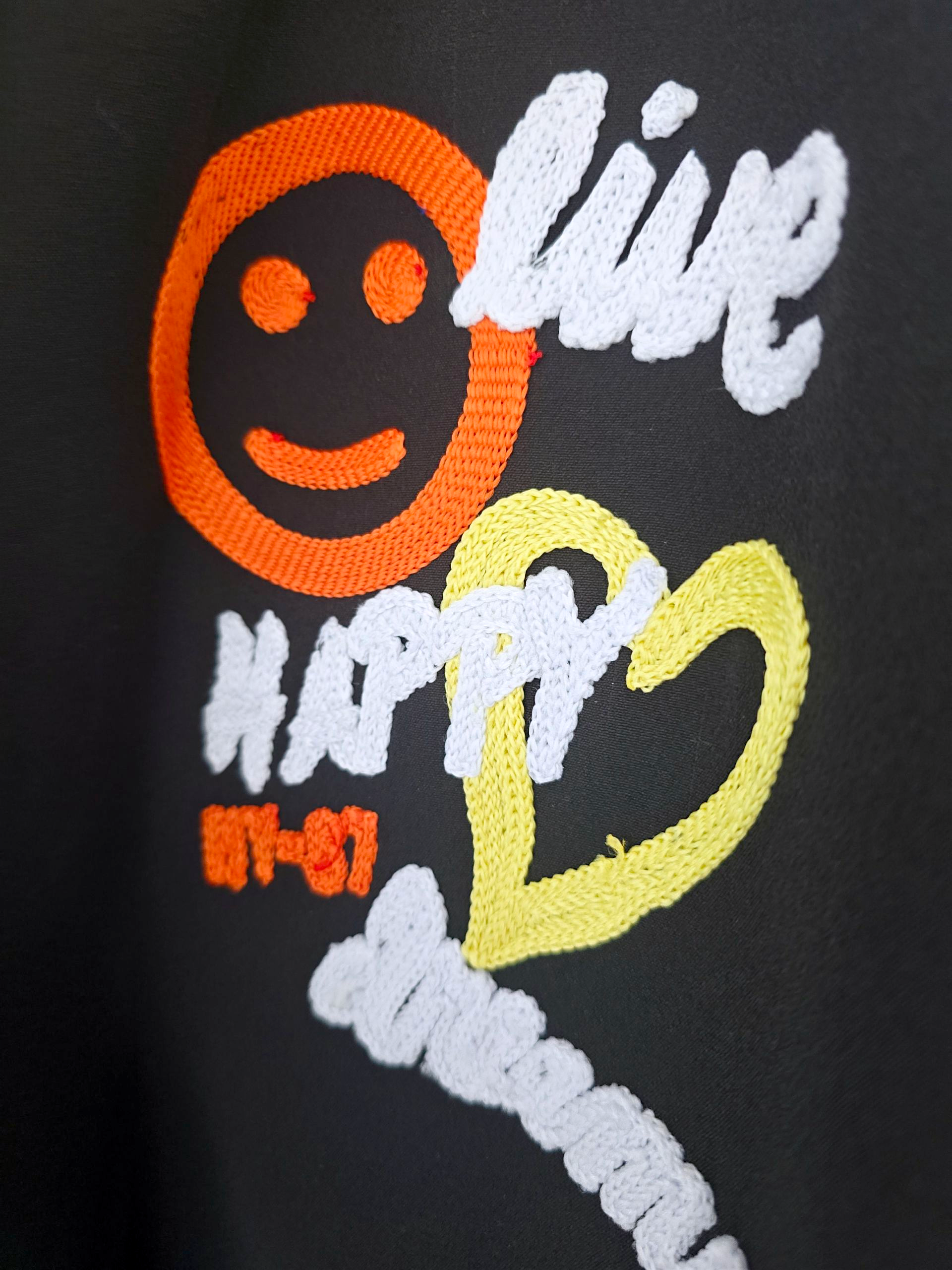 Veste noire à tags smiley