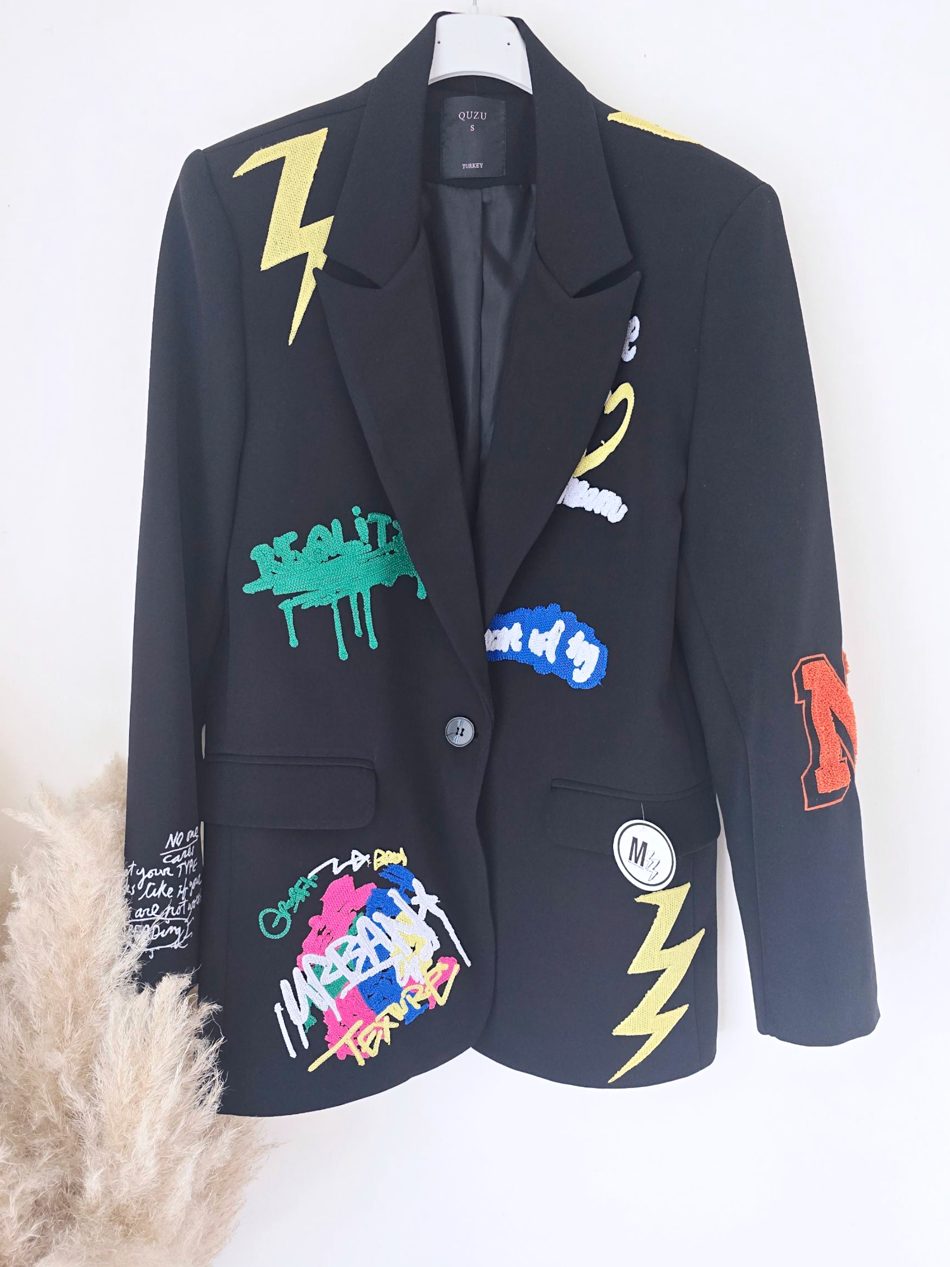 Veste noire à tags smiley