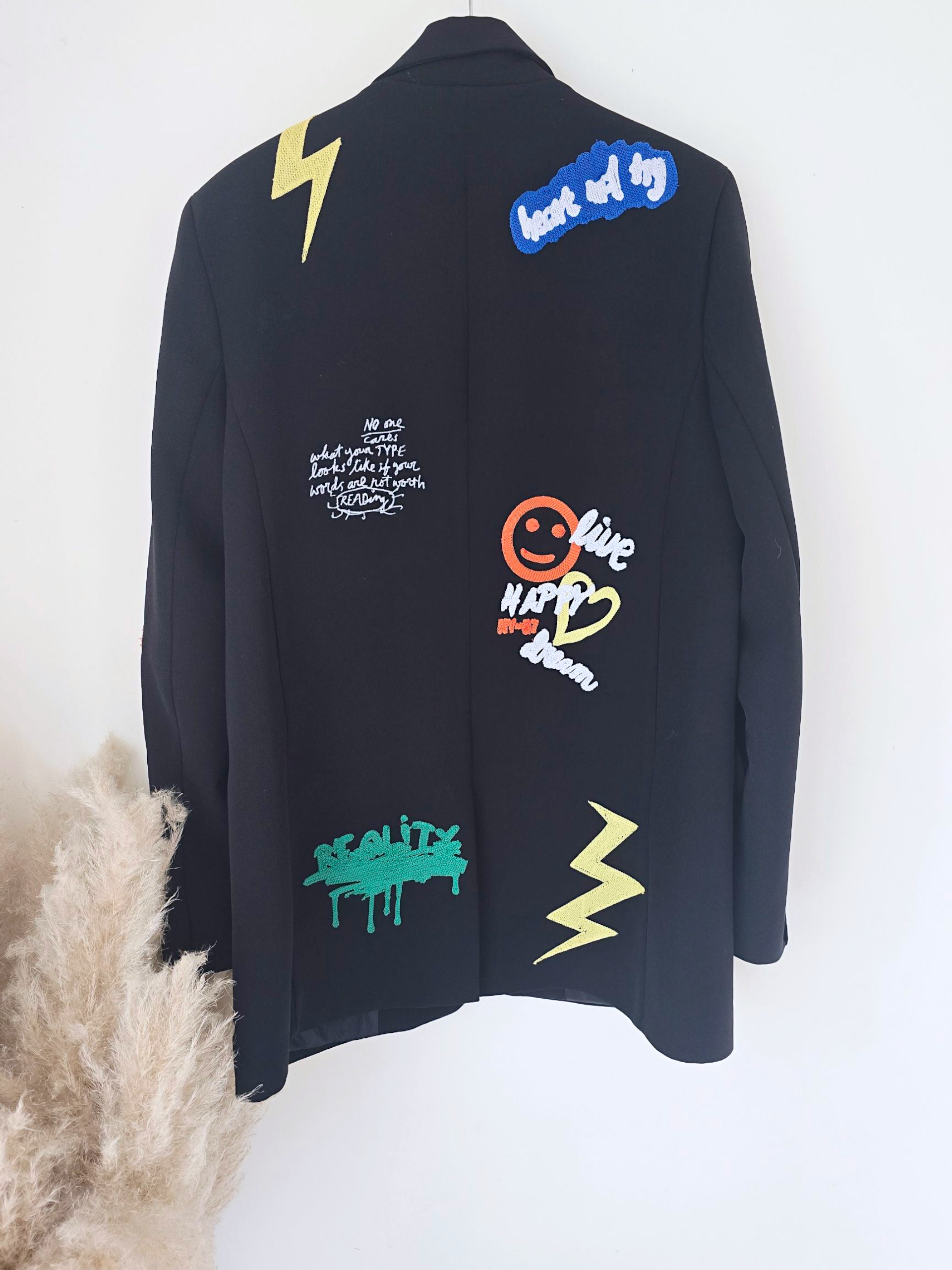 Veste noire à tags smiley