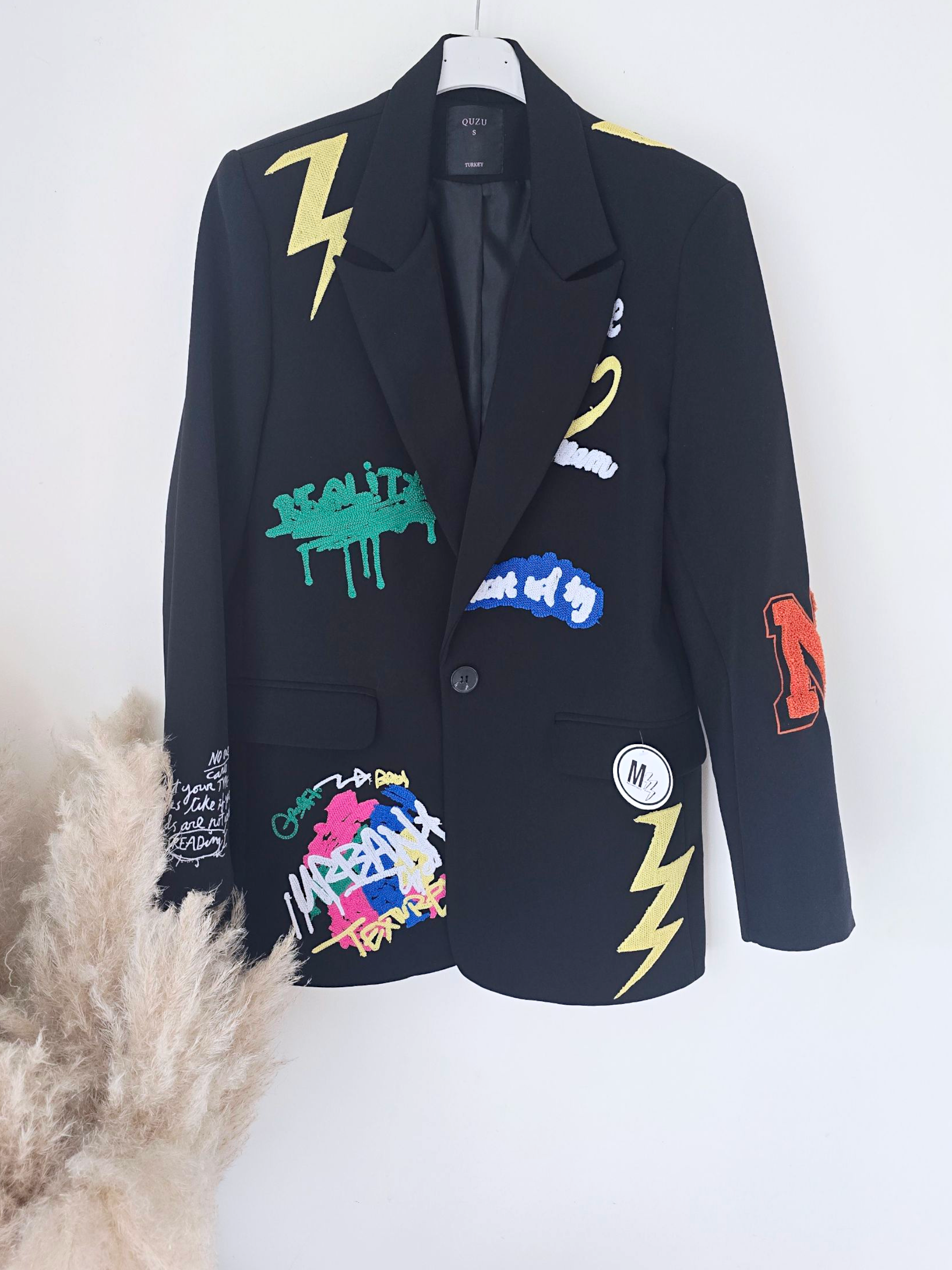 Veste noire à tags smiley