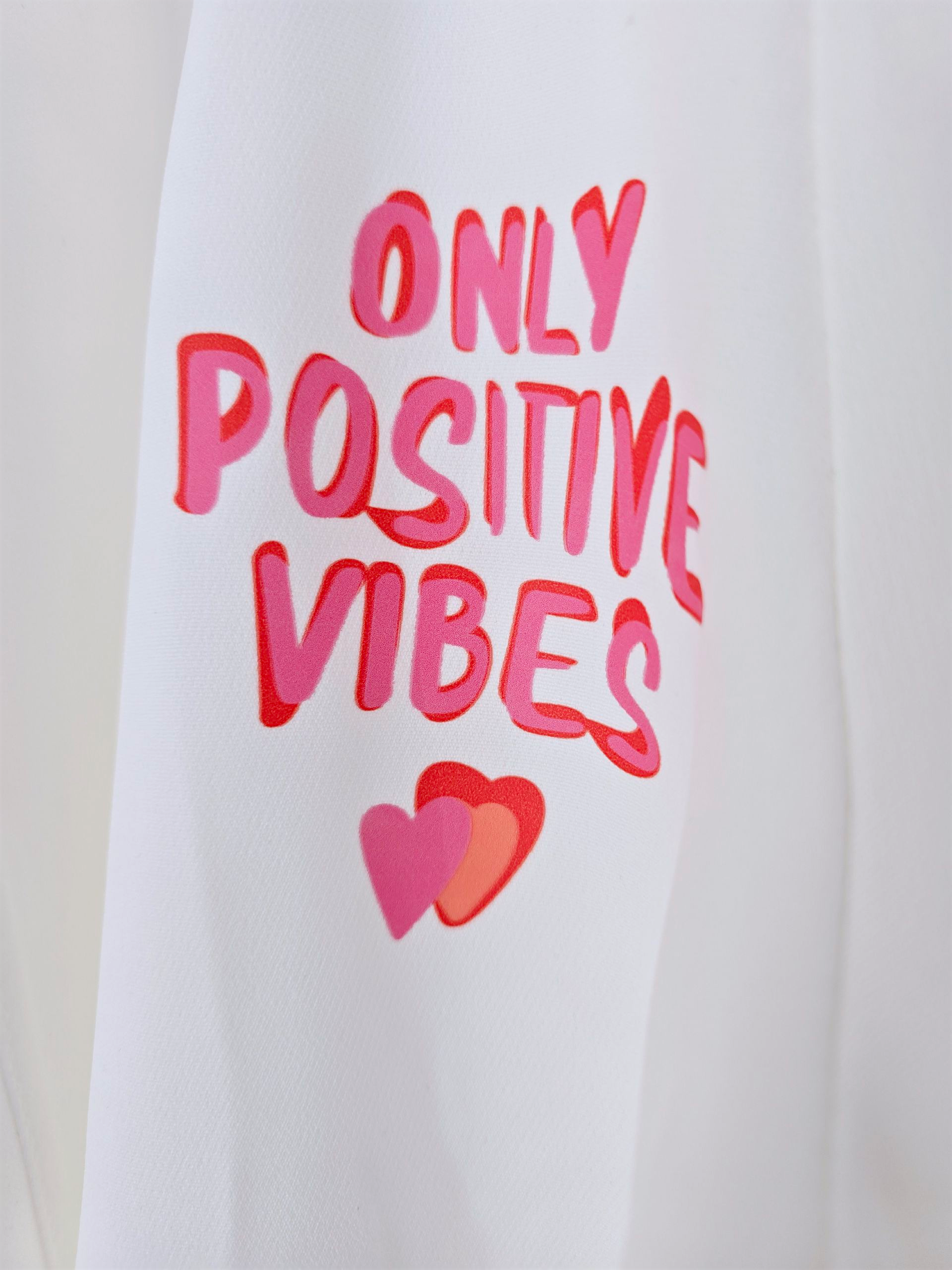 Blazer blanc à tags roses