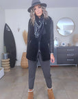 Manteau teddy noir manches cuir et peau retournée