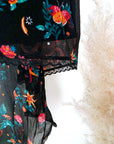 Jupe asymétrique noire à imprimé fleuri
